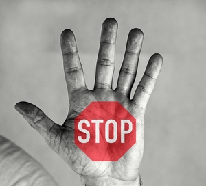 stop sign on a hand