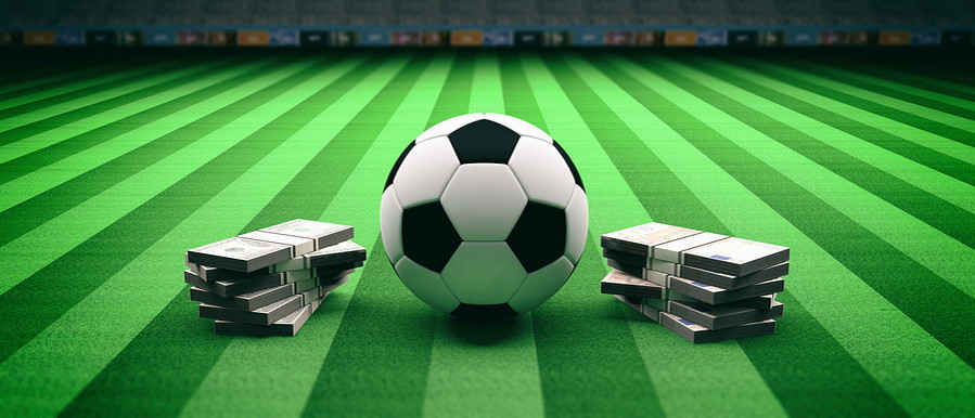 football on a ptich surrounded by money